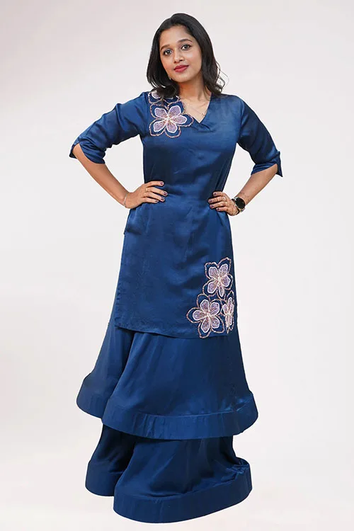 The Almond Blossom Lehenga at full length: the navy tunic with its lilac blossoms worn over a full navy skirt with a deep hem band