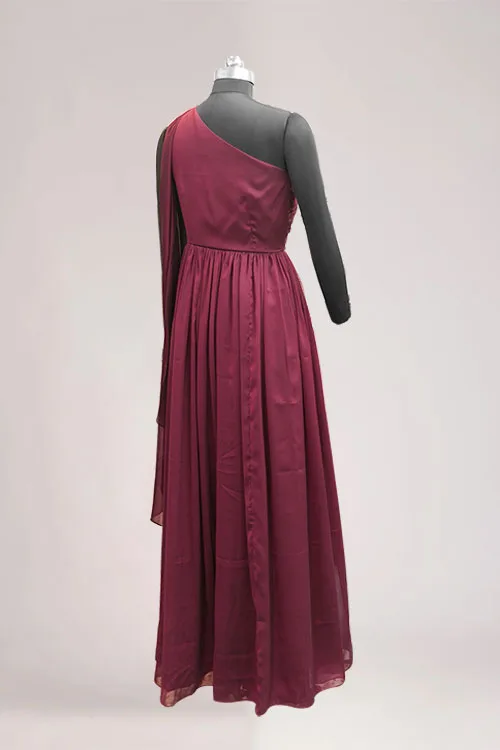 A closer view of the Ethereal One-Shoulder's wine georgette skirt, gathered at the waist and falling in soft folds